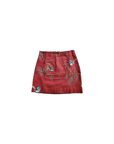 Red skirt with bird pattern on a white background